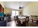Bright dining area with large table, ideal for Gathering meals and entertaining guests at 378 Cole Sw Dr, Lilburn, GA 30047