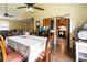 Dining room with a large table and direct access to the kitchen and living areas at 378 Cole Sw Dr, Lilburn, GA 30047
