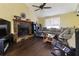 Open living room with fireplace, neutral-colored walls, and a large window for natural light at 378 Cole Sw Dr, Lilburn, GA 30047