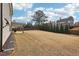 Extensive backyard offering ample space for recreation and outdoor living at 504 Taymack Farm Ct, Woodstock, GA 30188