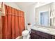 Well-appointed bathroom with decorative shower curtain, granite vanity and modern fixtures at 504 Taymack Farm Ct, Woodstock, GA 30188