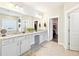 Stylish bathroom vanity with granite countertop, double sinks and ample storage space at 504 Taymack Farm Ct, Woodstock, GA 30188