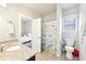 Bathroom featuring a granite countertop, tile floors, and a shower with a bright butterfly shower curtain at 504 Taymack Farm Ct, Woodstock, GA 30188