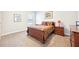 Bedroom with neutral carpet, a window, and a complete set of wooden furniture at 504 Taymack Farm Ct, Woodstock, GA 30188