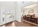 Welcoming entryway boasts natural light and leads to an elegant dining area with wainscoting at 504 Taymack Farm Ct, Woodstock, GA 30188