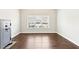 Versatile room with hardwood flooring, large window and secure WASATCH safe at 504 Taymack Farm Ct, Woodstock, GA 30188