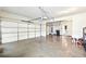 Spacious two-car garage with painted walls and a sealed concrete floor at 504 Taymack Farm Ct, Woodstock, GA 30188