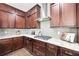 Gourmet kitchen with granite countertops, stainless appliances, and ample cabinet storage at 504 Taymack Farm Ct, Woodstock, GA 30188