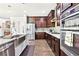 Modern kitchen with stainless steel appliances and gorgeous countertops provides space for cooking at 504 Taymack Farm Ct, Woodstock, GA 30188