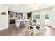 Bright kitchen with stainless steel appliances, a large island, and a seamless flow to the dining area at 504 Taymack Farm Ct, Woodstock, GA 30188