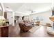 Spacious living room with hardwood floors, fireplace, and an open floor plan to the kitchen at 504 Taymack Farm Ct, Woodstock, GA 30188