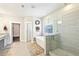Luxurious main bathroom featuring separate shower, soaking tub, and elegant finishes at 504 Taymack Farm Ct, Woodstock, GA 30188