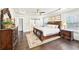 Serene main bedroom features tray ceiling, dark wood furniture, and ample natural light at 504 Taymack Farm Ct, Woodstock, GA 30188