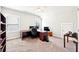 Bright office space with large desk, multiple monitors and neutral carpeting at 504 Taymack Farm Ct, Woodstock, GA 30188