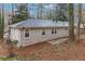 The backyard includes a patio and beautiful natural surroundings, perfect for outdoor entertaining and relaxation at 1883 Windsor Sw Dr, Atlanta, GA 30311