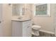Well-lit bathroom featuring a modern vanity, granite countertop, and updated fixtures at 1883 Windsor Sw Dr, Atlanta, GA 30311