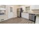 Modern kitchen with stainless steel appliances, granite countertops, and white cabinetry at 1883 Windsor Sw Dr, Atlanta, GA 30311