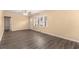 Bright living room boasts hardwood floors, neutral paint, and a large window for natural light at 1883 Windsor Sw Dr, Atlanta, GA 30311