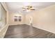 Inviting living room featuring hardwood floors, a ceiling fan, and plenty of natural light at 1883 Windsor Sw Dr, Atlanta, GA 30311