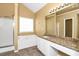 Bathroom features a soaking tub, shower, granite countertops, and lots of light at 4678 Ravenwood Loop, Union City, GA 30291
