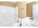 Bright bathroom with tub, shower, toilet, vanity, and mirror at 4678 Ravenwood Loop, Union City, GA 30291