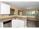 Kitchen featuring granite counters, stainless steel sink, stainless steel dishwasher, and tile floors at 4678 Ravenwood Loop, Union City, GA 30291