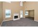 Spacious living room boasts a fireplace, large windows, and open layout at 4678 Ravenwood Loop, Union City, GA 30291