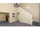 Inviting living space with open floor plan connects kitchen and staircase at 4678 Ravenwood Loop, Union City, GA 30291