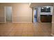 Finished basement with tile flooring, bar area, and ample space for entertaining at 745 Queen Ann Court, Stonecrest, GA 30083