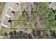 Aerial view of the homes and lots showing mature trees, a wooden fence, and surrounding neighborhood at 780 Mccart Rd, Lawrenceville, GA 30045