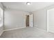 Neutral bedroom featuring carpeting, a window for natural light, and a white interior door at 780 Mccart Rd, Lawrenceville, GA 30045
