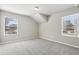 Neutral bedroom with 2 large windows with beautiful outdoor views and plush carpeting at 780 Mccart Rd, Lawrenceville, GA 30045