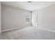 Light and airy bedroom with plush carpet and a window offering outdoor views at 780 Mccart Rd, Lawrenceville, GA 30045
