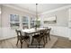 Bright dining room with large windows, stylish light fixture, and wainscoting at 780 Mccart Rd, Lawrenceville, GA 30045