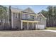 Charming two-story home with gray siding, a covered front porch, a two-car garage, and a well-maintained lawn at 780 Mccart Rd, Lawrenceville, GA 30045