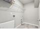 Utility room with shelving and laundry hookups, ready for appliances and storage at 780 Mccart Rd, Lawrenceville, GA 30045