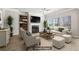 Bright living room with a fireplace, built-in shelving, stylish furniture, and ample natural light from large windows at 780 Mccart Rd, Lawrenceville, GA 30045
