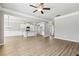 Spacious open layout showcasing the living area seamlessly flowing into the kitchen with a central island at 780 Mccart Rd, Lawrenceville, GA 30045