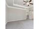 Bright main bedroom features a tray ceiling, carpeted floor and three large windows at 780 Mccart Rd, Lawrenceville, GA 30045