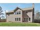 Two-story home with gray siding, many windows, green grass and a wood fence at 780 Mccart Rd, Lawrenceville, GA 30045