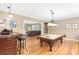 Entertaining game room features a bar, pool table, and hardwood floors at 1967 Mason Mill Rd, Decatur, GA 30033