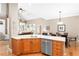 Open concept kitchen with stainless appliances, granite countertops, and hardwood floors at 1967 Mason Mill Rd, Decatur, GA 30033