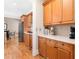 Galley kitchen featuring warm wood cabinets, stainless steel appliances, and quartz countertops at 1967 Mason Mill Rd, Decatur, GA 30033