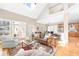 Living room featuring hardwood floors, fireplace, and high ceilings with lots of natural light at 1967 Mason Mill Rd, Decatur, GA 30033