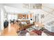 Open concept living room with hardwood floors, staircase, and stainless kitchen appliances at 1967 Mason Mill Rd, Decatur, GA 30033
