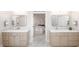 Double vanity bathroom with neutral-toned cabinetry that opens into a bedroom and standing glass shower at 1967 Mason Mill Rd, Decatur, GA 30033