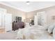 Spacious main bedroom with ceiling fan, large dresser and doorway leading to the main bath at 1967 Mason Mill Rd, Decatur, GA 30033