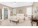 Serene main bedroom with tray ceilings, neutral decor, and lots of natural light from surrounding windows at 1967 Mason Mill Rd, Decatur, GA 30033