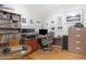 Well-organized home office with a desk, filing cabinet, shelving and a display of decorative photos at 1967 Mason Mill Rd, Decatur, GA 30033