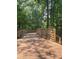 Wooden boardwalk-style bridge in lush green park, surrounded by tall trees and nature at 1967 Mason Mill Rd, Decatur, GA 30033